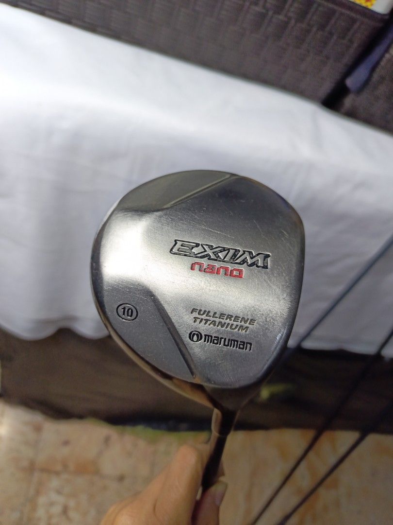 Maruman EXIM Nano Fullerene Titanium Driver (Category: Golf) located in Manila. Submitted by yeonmei5614747 (Listing ID 1428847505, Image 1). Description: Maruman EXIM Nano driver with a 10-degree loft. Features Fullerene Titanium technology. The shaft is labeled EXIM SECT X02. The grip is black. The club head shows some signs of use..