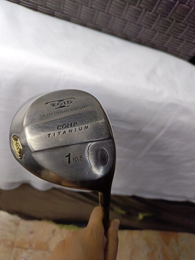 Mizuno Zoid Comp Titanium Driver (Category: Golf) located in Manila. Submitted by yeonmei5614747 (Listing ID 1428852426, Image 1). Description: Mizuno Zoid Comp Titanium driver with a 10.5 loft. Features a TR-X Scientific weight control shaft. The grip is a dark color with a textured surface. The club head has the Mizuno logo. The shaft has PRGR M-37 markings..