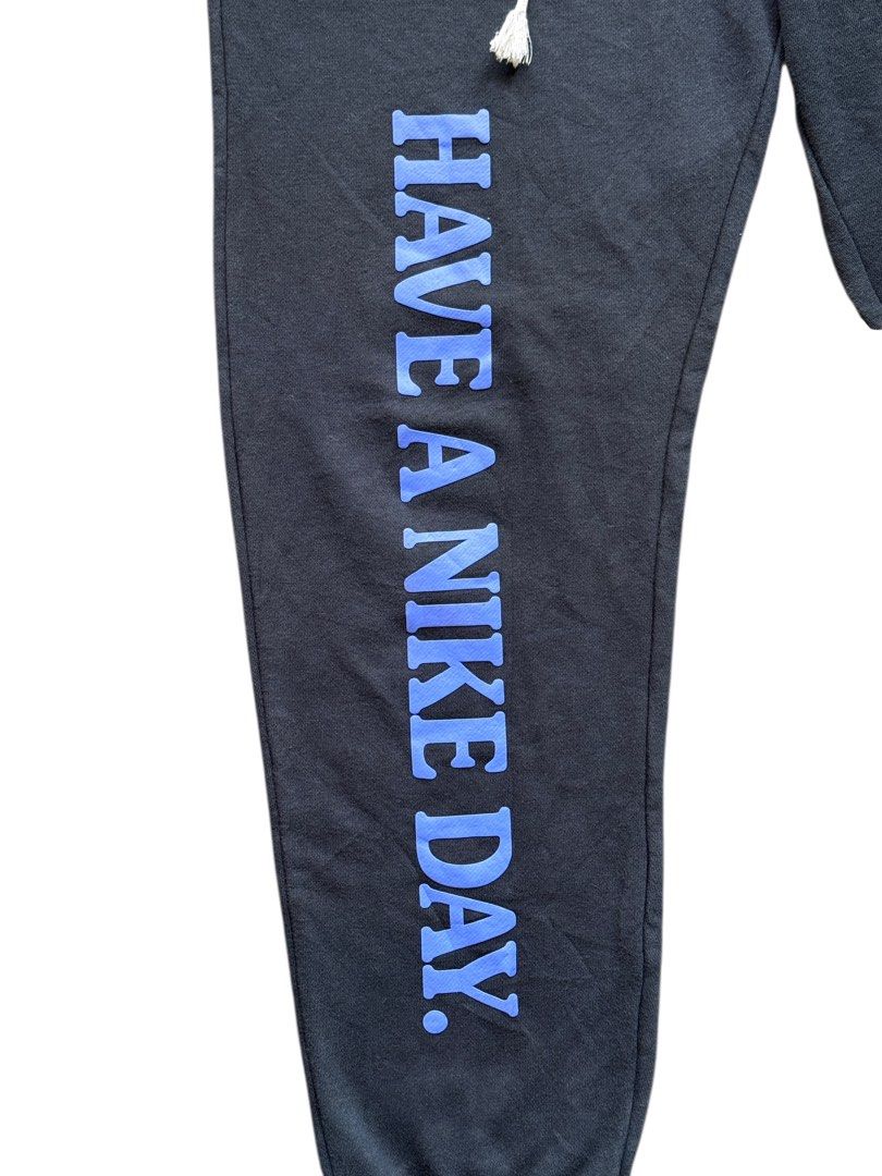 Nike Have A Nike Day Sweatpants (Category: Joggers) located in Mariveles. Submitted by klingqt (Listing ID 1428945889, Image 3). Description: Get ready to rep these comfy Nike sweatpants! Features include drawstring waist, back pocket, and sweet designs on the legs. Left leg says “Have A Nike Day” and the right leg has a Nike logo with a daisy. Peace sign logo on the back. Size M, Made in China. ‼️DM FOR MORE INFO‼️ #nike #thrift #sweatpants #run