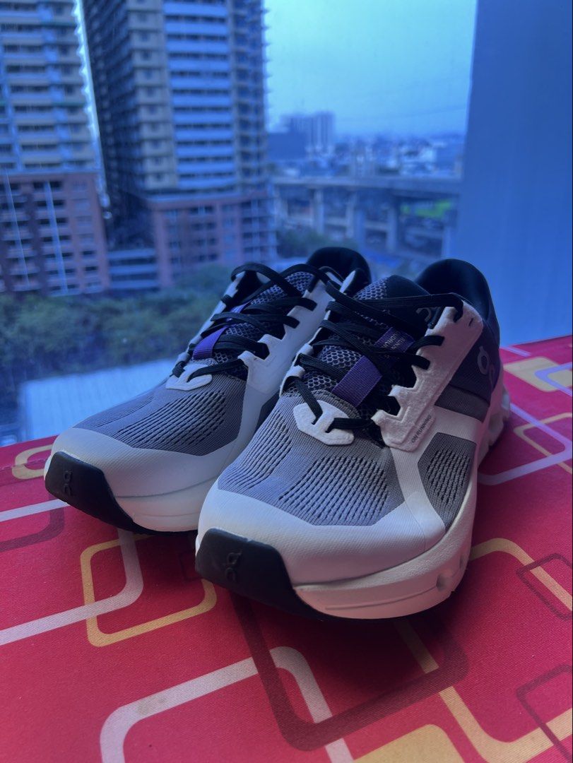 On CloudTec Running Shoes - US M8 (Category: Sneakers) located in Makati City. Submitted by nicolaylay (Listing ID 1428987846, Image 2). Description: On CloudTec running shoes in a white, grey, and purple colorway. Features a breathable mesh upper and a cushioned sole. The shoes have a lace-up closure and the On logo is visible on the side. The size is US M8, EU 41, and JP 26. Made in Vietnam..