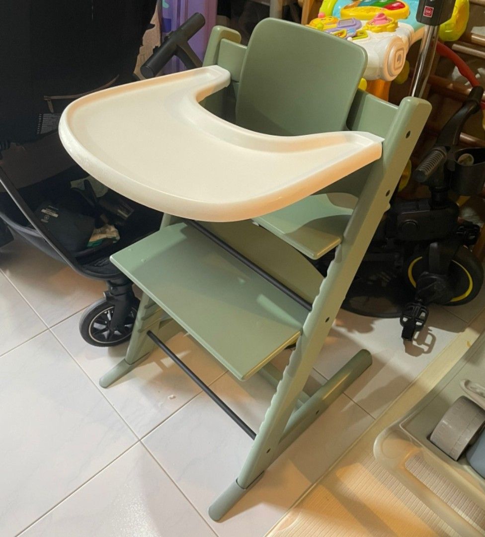 Preloved Stokke inspired High Chair - Green (Category: Baby High Chairs) located in Singapore. Submitted by yourlilsurprise (Listing ID 1428904141, Image 1). Description: Includes the tray. The chair is a lovely green color. Perfect for mealtimes! Minor signs of use, but overall well-maintained and ready for a new home..