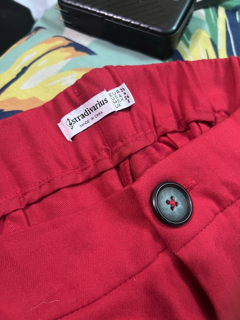 Stradivarius Red Trousers (Category: Other Bottoms) located in San Jose del Monte. Submitted by sofiah2997 (Listing ID 1428803546, Image 3). Description: Stylish red trousers from Stradivarius. Features a button closure and a classic design. The size is EUR 36, UK 8, and US 4. Made in China. Perfect for creating a chic and versatile look. These trousers are a great addition to any wardrobe..