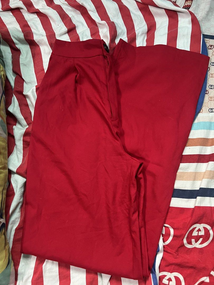 Stradivarius Red Trousers (Category: Other Bottoms) located in San Jose del Monte. Submitted by sofiah2997 (Listing ID 1428803546, Image 2). Description: Stylish red trousers from Stradivarius. Features a button closure and a classic design. The size is EUR 36, UK 8, and US 4. Made in China. Perfect for creating a chic and versatile look. These trousers are a great addition to any wardrobe..