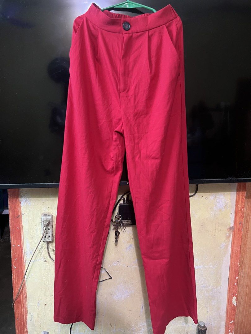 Stradivarius Red Trousers (Category: Other Bottoms) located in San Jose del Monte. Submitted by sofiah2997 (Listing ID 1428803546, Image 1). Description: Stylish red trousers from Stradivarius. Features a button closure and a classic design. The size is EUR 36, UK 8, and US 4. Made in China. Perfect for creating a chic and versatile look. These trousers are a great addition to any wardrobe..