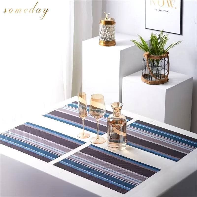 Striped Placemats - Set of 4 (Category: Table Linen & Textiles) located in Manila. Submitted by nixdcruz (Listing ID 1428928070, Image 2). Description: Set of four stylish placemats featuring a striped design. These placemats are perfect for adding a touch of elegance to your dining table. They are made of a durable material and are easy to clean. Available in various colors to match your decor. Great for everyday use or special occasions..