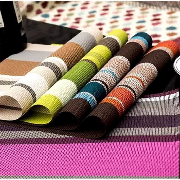 Striped Placemats - Set of 4 (Category: Table Linen & Textiles) located in Manila. Submitted by nixdcruz (Listing ID 1428928070, Image 1). Description: Set of four stylish placemats featuring a striped design. These placemats are perfect for adding a touch of elegance to your dining table. They are made of a durable material and are easy to clean. Available in various colors to match your decor. Great for everyday use or special occasions..