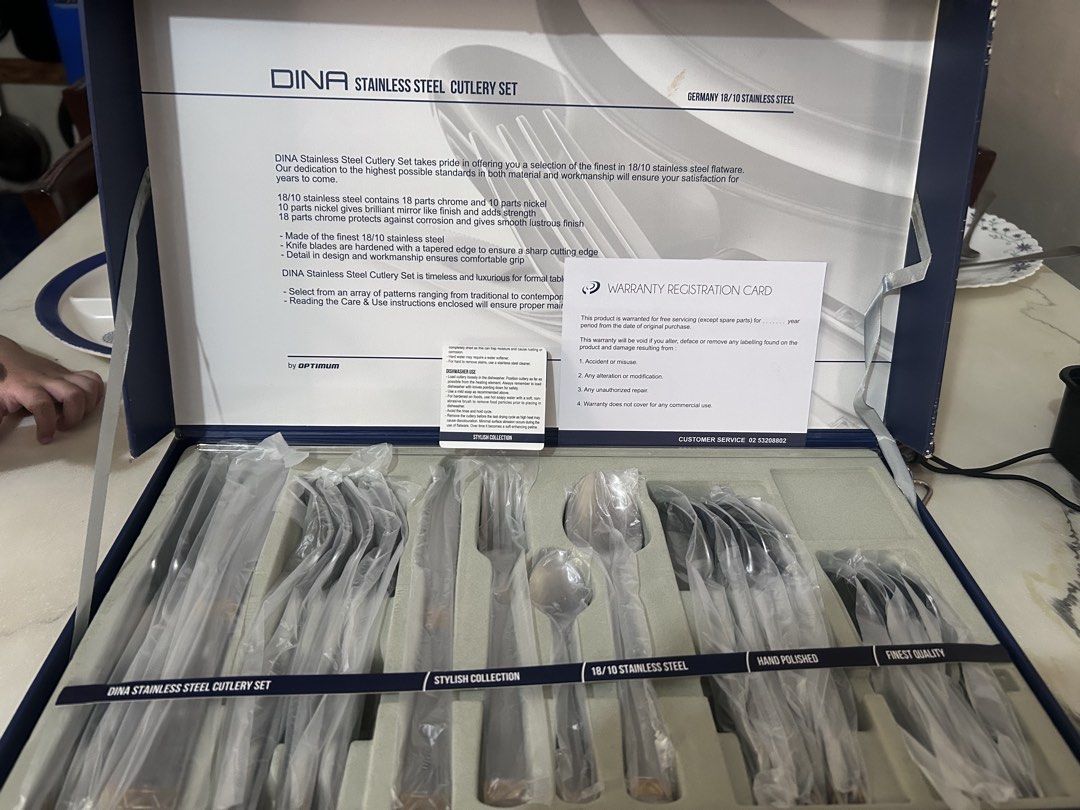 Stylish Collection Cutlery Set (Category: Dinnerware & Cutlery) located in Lubao. Submitted by appleglaze (Listing ID 1428814101, Image 2). Description: Elegant cutlery set from the Stylish Collection. The set includes a spoon, fork, knife, and another spoon. The handles have a silver and gold design. The set is in its original packaging..