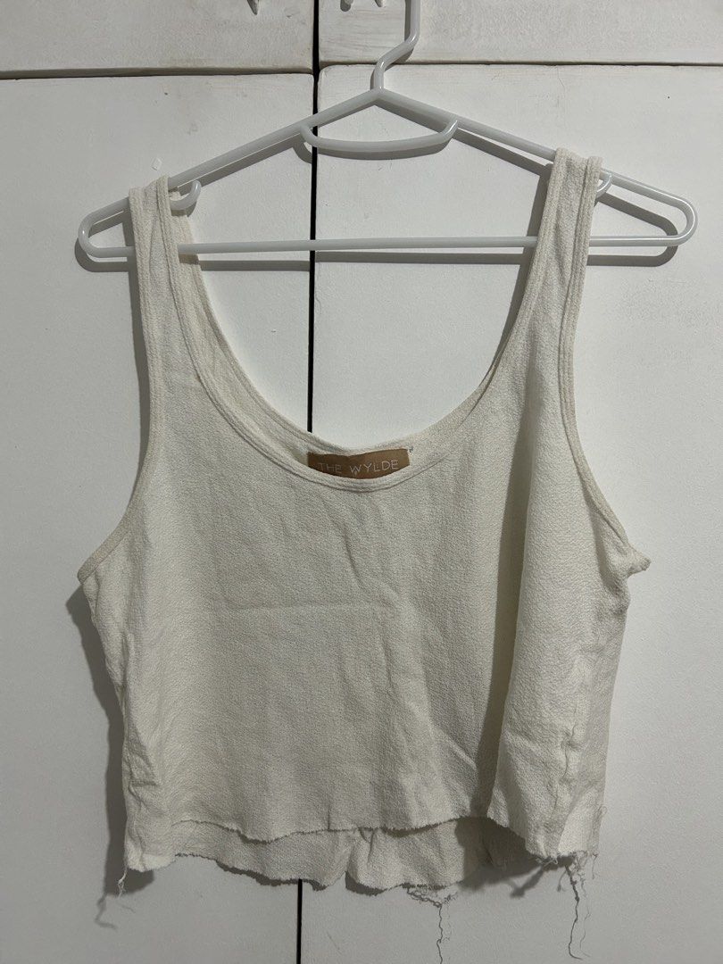 The Wylde White Tank Top (Category: Sleeveless) located in Santa Rosa. Submitted by allisonburgers (Listing ID 1428794139, Image 1). Description: From Tracianne and Tracienne preloved Helping tags: Alo yoga Sora towel.