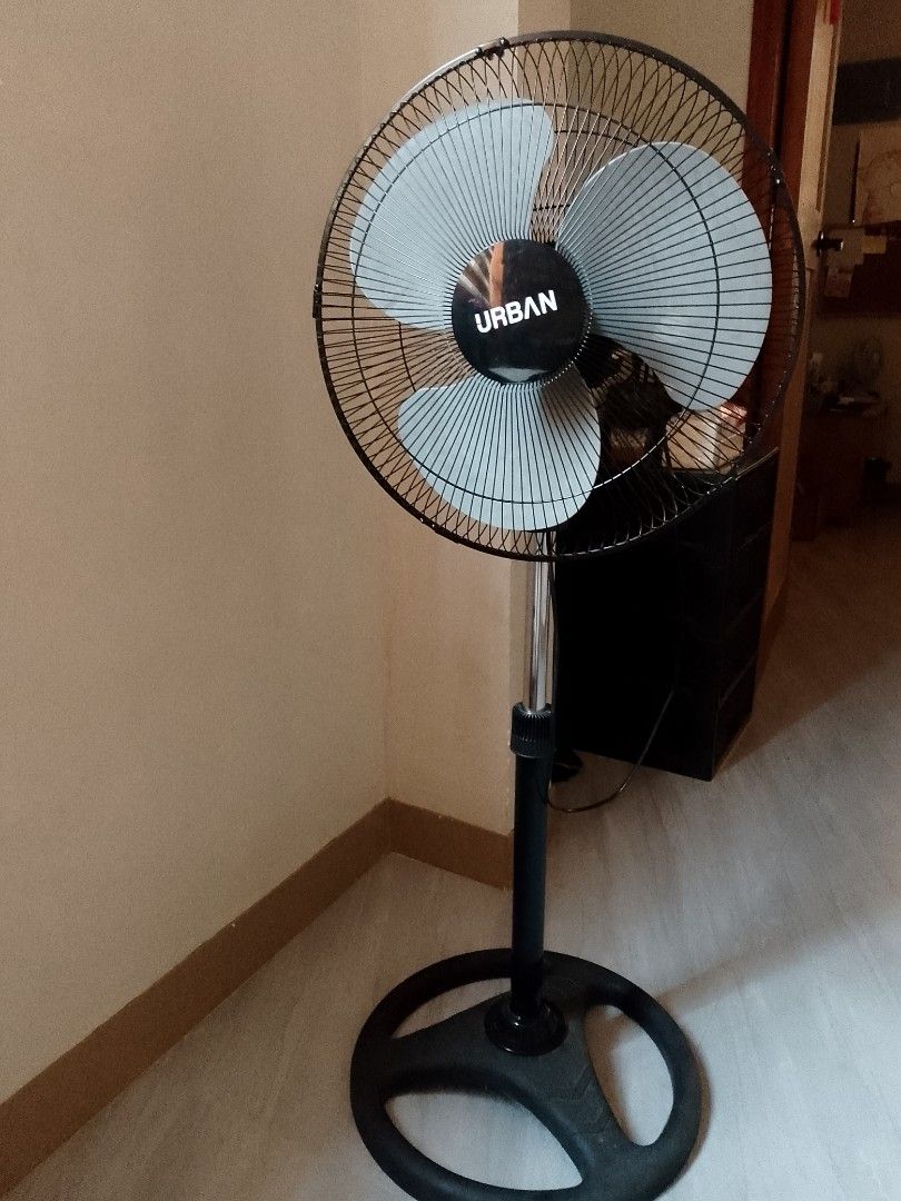 Urban Stand Fan USF-16RB (Category: Fans) located in Taytay. Submitted by looids (Listing ID 1428833801, Image 1). Description: Urban stand fan with a 405 mm size. It operates at 230V~60Hz and consumes 50W. The fan has a black base, stand, and cage. The model number is USF-16RB. It has a serial number of 2406001183. The fan includes a thermal fuse inside the motor..