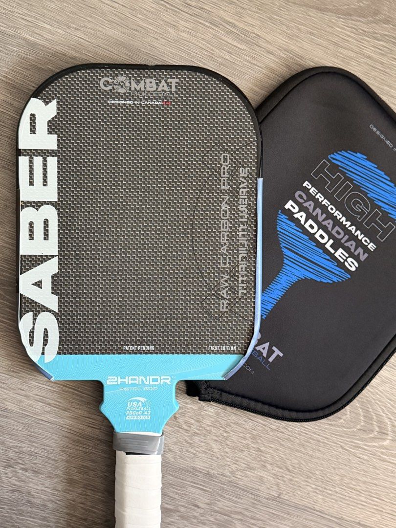Used Combat Saber Pro Pickleball Paddle 16mm first edition (Category: Racket and Ball Sports) located in Mandaluyong City. Submitted by emes9 (Listing ID 1428924922, Image 3). Description: Used Combat Saber Pro Pickleball Paddle 16mm first edition. Titanium weave thermoformed design. Solid unique paddle design. All around performance. High spin. With edge guard. And pouch In excellent condition. No issues.