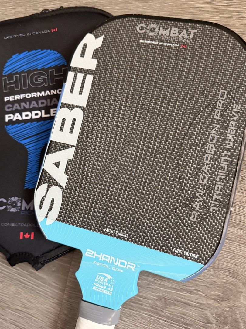 Used Combat Saber Pro Pickleball Paddle 16mm first edition (Category: Racket and Ball Sports) located in Mandaluyong City. Submitted by emes9 (Listing ID 1428924922, Image 2). Description: Used Combat Saber Pro Pickleball Paddle 16mm first edition. Titanium weave thermoformed design. Solid unique paddle design. All around performance. High spin. With edge guard. And pouch In excellent condition. No issues.