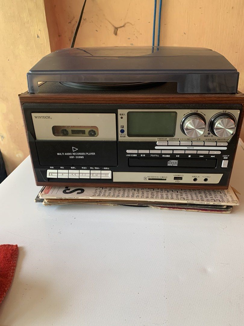 Wintech KRP-308MS Multi Audio Recorder/Player (Category: Soundbars, Speakers & Amplifiers) located in Calasiao. Submitted by beardmodefinds0707 (Listing ID 1428817656, Image 1). Description: Wintech KRP-308MS is a multi-function audio recorder/player. It features a turntable, cassette player, CD player, and radio. It also has USB and SD/SDHC card slots. The unit has controls for volume, radio tuning, and function selection. The back panel include