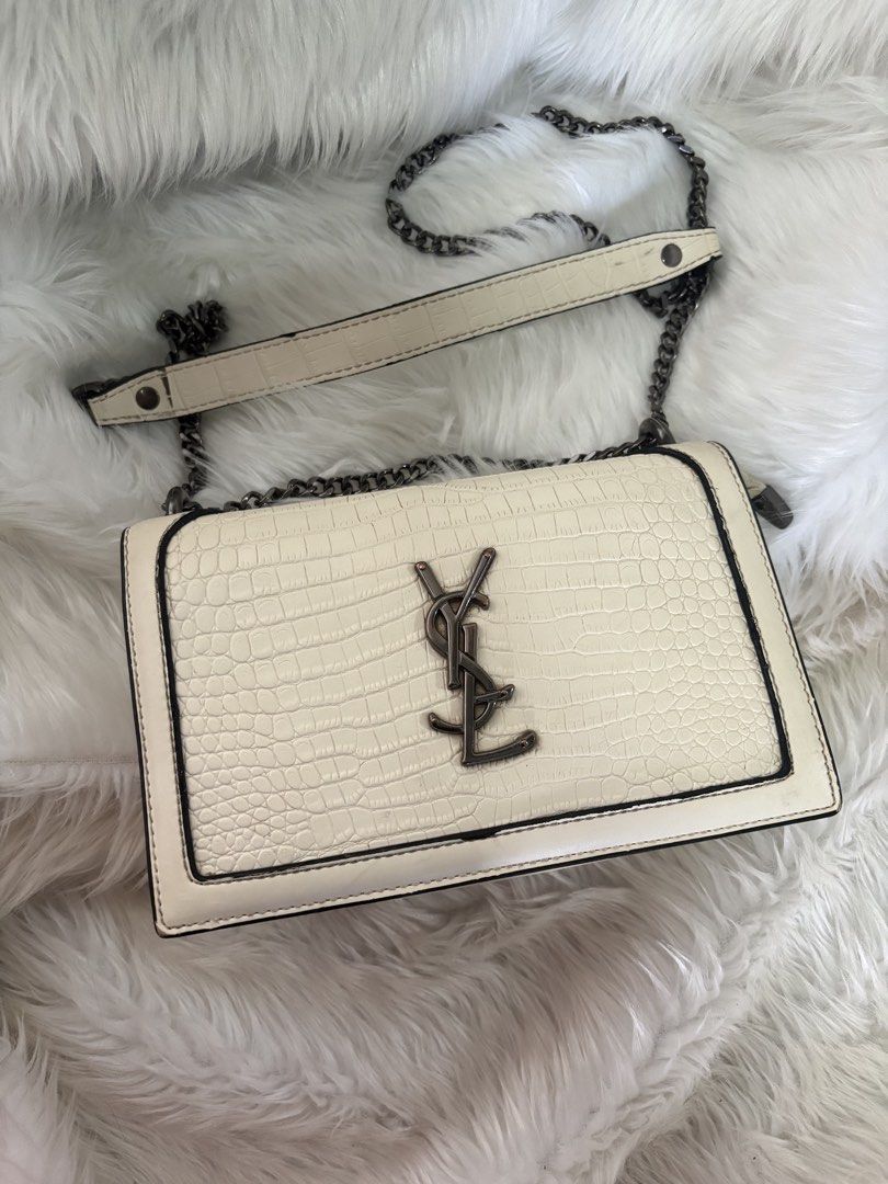 YSL Croc-Embossed Shoulder Bag no code (Category: Luxury Bags & Wallets) located in Davao. Submitted by emmanuelchuamellorin23 (Listing ID 1428814566, Image 2). Description: Not coded pero makapal mabigat Elegant shoulder bag featuring a croc-embossed design. It has a chain strap and a flap closure. The bag showcases the YSL logo on the front. The color is off-white with black trim. The strap is a combination of leather and chain..