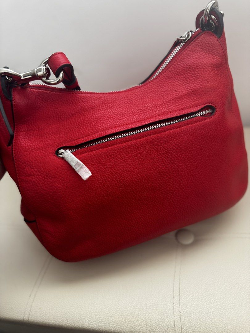 💯 Coach Jess Hobo Shoulder Bag (Category: Shoulder Bags) located in Agno. Submitted by ursecondhand_chic (Listing ID 1429139139, Image 2). Description: Coach Jess Hobo Shoulder Bag This item is a Coach Jess Hobo shoulder bag in Bright Cardinal pebbled leather with silver-tone hardware and rivet details •What you see is what you get •Medium to Semi Large in size •Studs as all intact on the shoulder strap •Honest Issue (Please see last pic): Medyo