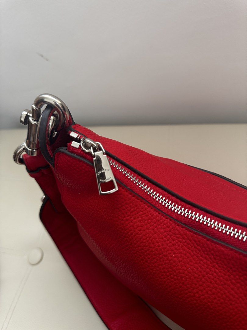 💯 Coach Jess Hobo Shoulder Bag (Category: Shoulder Bags) located in Agno. Submitted by ursecondhand_chic (Listing ID 1429139139, Image 3). Description: Coach Jess Hobo Shoulder Bag This item is a Coach Jess Hobo shoulder bag in Bright Cardinal pebbled leather with silver-tone hardware and rivet details •What you see is what you get •Medium to Semi Large in size •Studs as all intact on the shoulder strap •Honest Issue (Please see last pic): Medyo