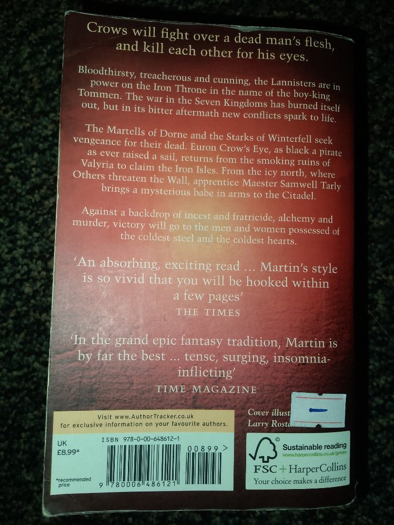 A Feast for Crows by George R.R. Martin (Category: Storybooks) located in Taytay. Submitted by jenn6849 (Listing ID 1429025181, Image 2). Description: Paperback copy of "A Feast for Crows" by George R.R. Martin. Published by Harper Voyager. The book is part of the "A Song of Ice and Fire" series. The back cover features quotes from The Times and Time Magazine. The book explores themes of war, betrayal, and power struggles within the Seven Kingdom