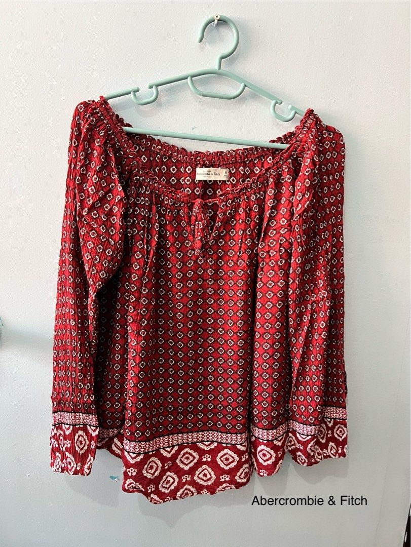 Abercrombie & Fitch Red Printed Blouse Boho Style (Category: Blouses) located in Manila. Submitted by brownqueen65310 (Listing ID 1429003892, Image 2). Description: Buy my outfit! Perfect outfit for a music fest Top: Abercrombie & Fitch - Pre-loved item - Red boho style long sleeves - Flowy and breathable, no structure - Minor defect by the ribbon Bottom: Khaki / brown colored skort - Pre-loved item - looks asymmetrical due to flap - 2 front pock