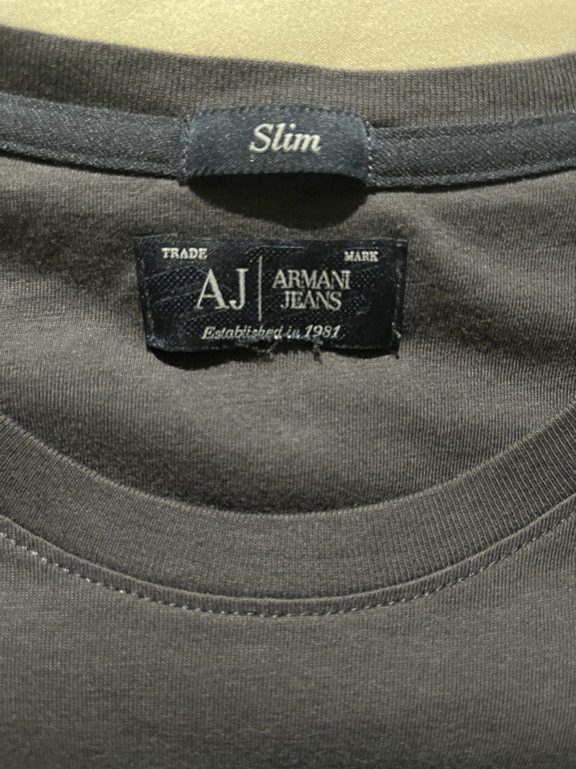 Armani Jeans Graphic T-shirt (Category: Tshirts & Polo Shirts ) located in Paranaque City. Submitted by vrias (Listing ID 1429150970, Image 2). Description: - 100% Original - Pristine Condition - Width 39 inches - Length 25 inches - Bought in Dubai Dutyfree ( My husband works at Dubai Dutyfree) - I removed the tag because my son feels uncomfortable when wearing shirts with tags. Location - Azure Bicutan Parañaque.