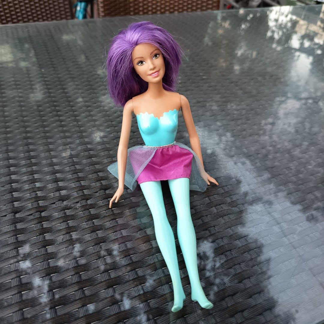 Authentic Barbie with Purple Hair (Category: Kids Toys) located in Pasig City. Submitted by wafflestore (Listing ID 1429021721, Image 1). Description: Authentic Barbie. Purple hair has been chopped to mid length. Doll is in good condition otherwise. Payment through GCash..