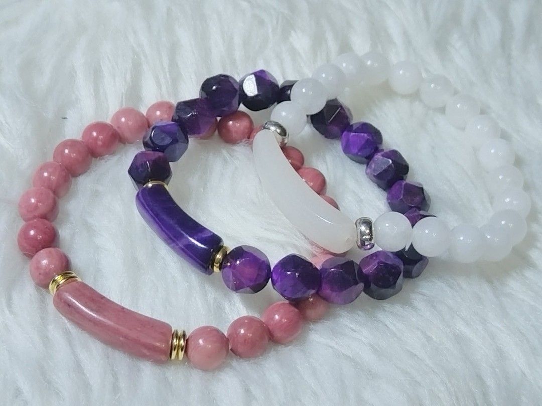 Beaded Bracelet Set - Purple, Pink, and White (Category: Bracelets) located in Quezon City. Submitted by ctraex (Listing ID 1429017193, Image 1). Description: Listing features a beautiful set of beaded bracelets. One bracelet has pink beads and a pink cylindrical accent with gold-colored details. Another bracelet has purple faceted beads and a purple cylindrical accent. The third bracelet has white round beads and a white crescent-shaped accent. 