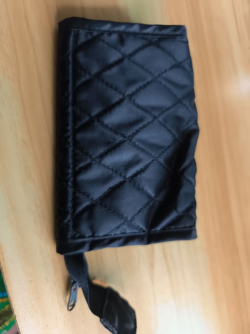 Black Quilted Wallet with Mirror (Category: Luxury Bags & Wallets) located in Cavite. Submitted by Combiishop (Listing ID 1429001689, Image 3). Description: Black wallet features a quilted design and a gold-colored clasp. It has a zippered compartment and includes a built-in mirror. It is compact and suitable for carrying small essentials. The interior has a pocket for coins and other small items..