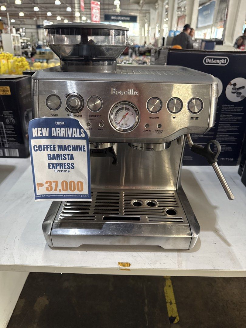 Breville Barista Express Coffee Machine (Category: Coffee Machines & Makers) located in Manila. Submitted by joylontok16 (Listing ID 1429003135, Image 1). Description: Breville Barista Express coffee machine. Features a built-in grinder, various control dials, and a pressure gauge. The machine has a stainless steel finish. The price tag indicates a price of ₱37,000. The machine is designed for making espresso and other coffee beverages..
