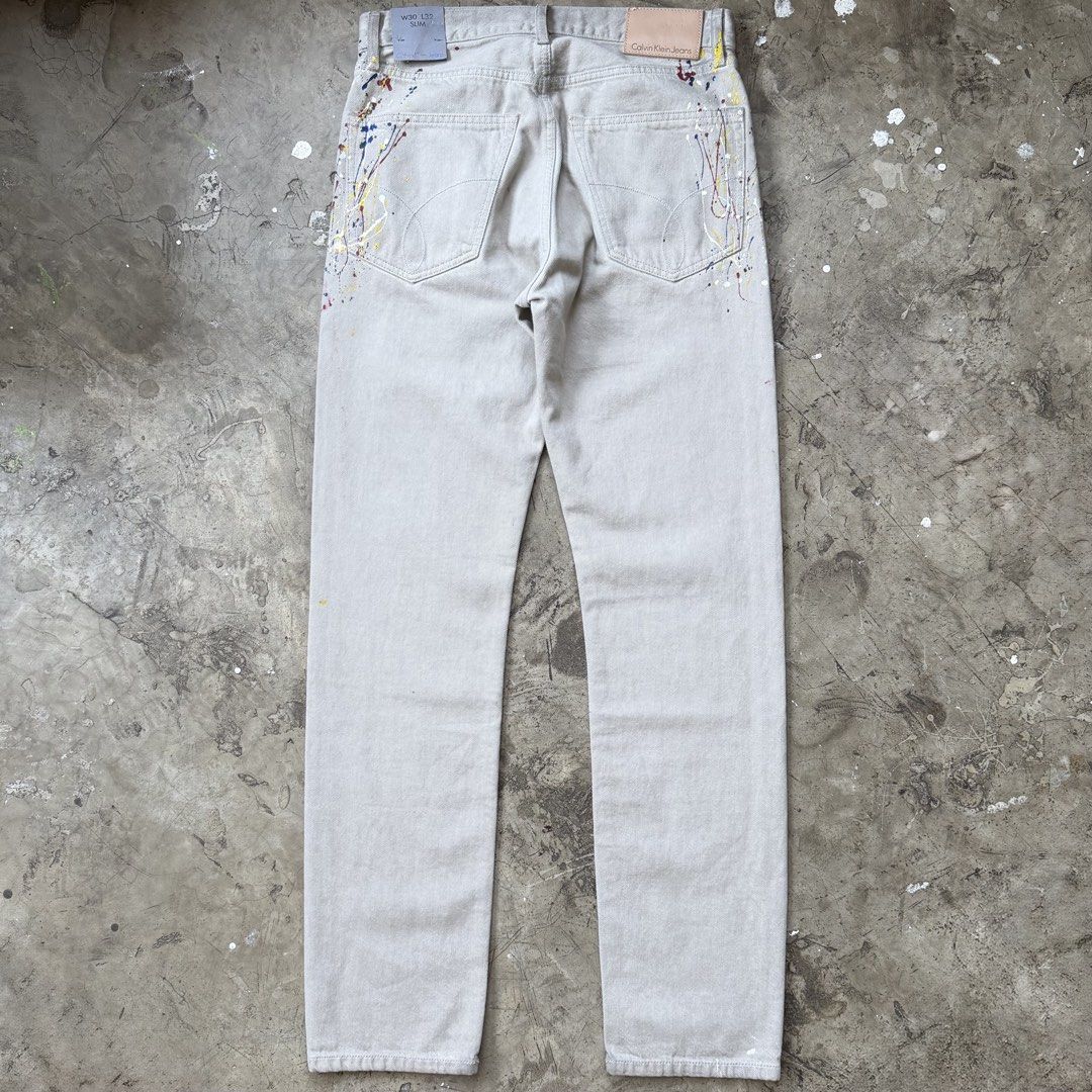 Calvin Klein - Raf Simons - Paint Splatter Jeans (Category: Jeans) located in Cavite. Submitted by 4118.ph (Listing ID 1429112569, Image 2). Description: Size 30 Deadstock with tag Waist 15” Length 42.5” Inseam 32” Leg opening 7”.