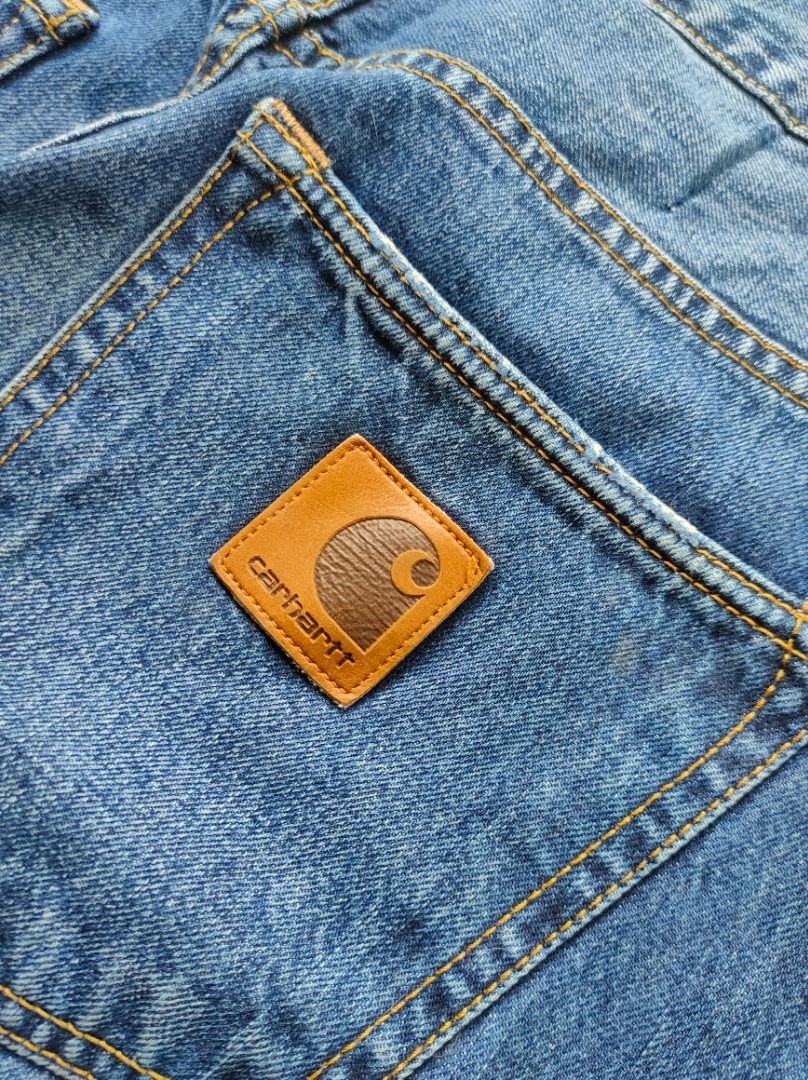 Carhartt Blue Button Fly Denim Jeans/Pants (Authentic) (Category: Jeans) located in Baguio. Submitted by pormado (Listing ID 1429106659, Image 3). Description: Classic Carhartt denim jeans in a versatile blue wash. Features a button fly and the iconic Carhartt logo patch on the back pocket. The jeans have a regular fit and a classic five-pocket design. The denim shows some fading, adding to its character. Perfect for everyday wear. Excellent Cond