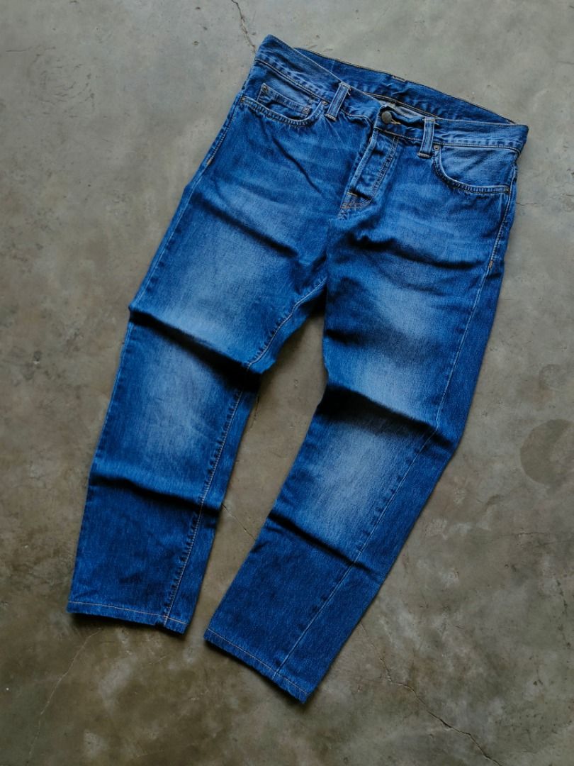 Carhartt Blue Button Fly Denim Jeans/Pants (Authentic) (Category: Jeans) located in Baguio. Submitted by pormado (Listing ID 1429106659, Image 2). Description: Classic Carhartt denim jeans in a versatile blue wash. Features a button fly and the iconic Carhartt logo patch on the back pocket. The jeans have a regular fit and a classic five-pocket design. The denim shows some fading, adding to its character. Perfect for everyday wear. Excellent Cond