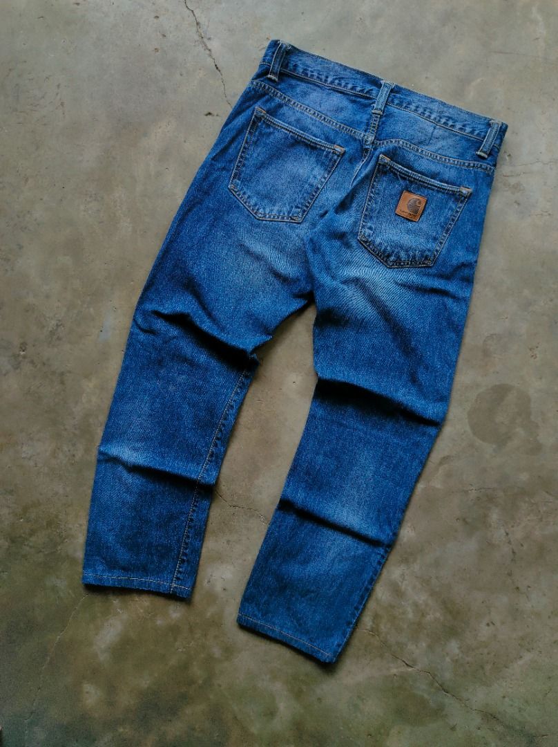 Carhartt Blue Button Fly Denim Jeans/Pants (Authentic) (Category: Jeans) located in Baguio. Submitted by pormado (Listing ID 1429106659, Image 1). Description: Classic Carhartt denim jeans in a versatile blue wash. Features a button fly and the iconic Carhartt logo patch on the back pocket. The jeans have a regular fit and a classic five-pocket design. The denim shows some fading, adding to its character. Perfect for everyday wear. Excellent Cond