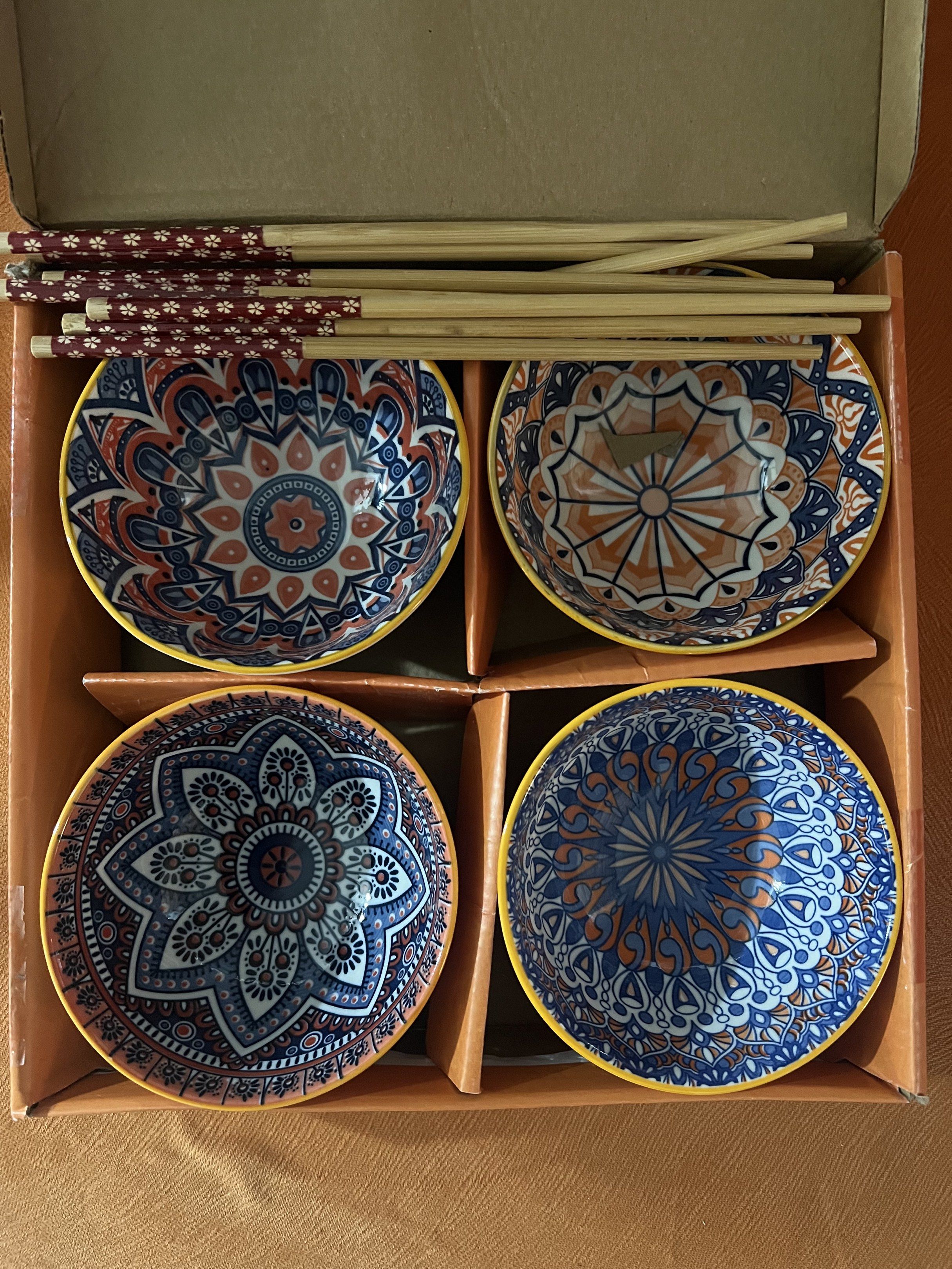 Ceramic Style Bowl Set with Chopsticks (Category: Dinnerware & Cutlery) located in Manila. Submitted by pau_only (Listing ID 1429160981, Image 2). Description: Ceramic bowl set features a unique, colorful design. The set includes four bowls and chopsticks. The bowls have a textured exterior and a vibrant interior pattern. Perfect for serving soups, noodles, or other dishes. The set comes in its original packaging, making it a great gift option..