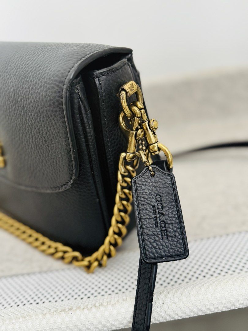 Coach Cassie Crossbody 19 (Category: Cross-body Bags) located in Cavite. Submitted by chaidc (Listing ID 1429049625, Image 3). Description: Brand: Coach Model: Cassie Crossbody 19 Color: Black with gold hardware Material: Refined pebble leather Details: • Turn-lock closure • Detachable top handle • Detachable long strap (crossbody) • Gold chain strap included • Multiple compartments (very practical) Inclusions: dust bag / Gold chain, 2 detachable