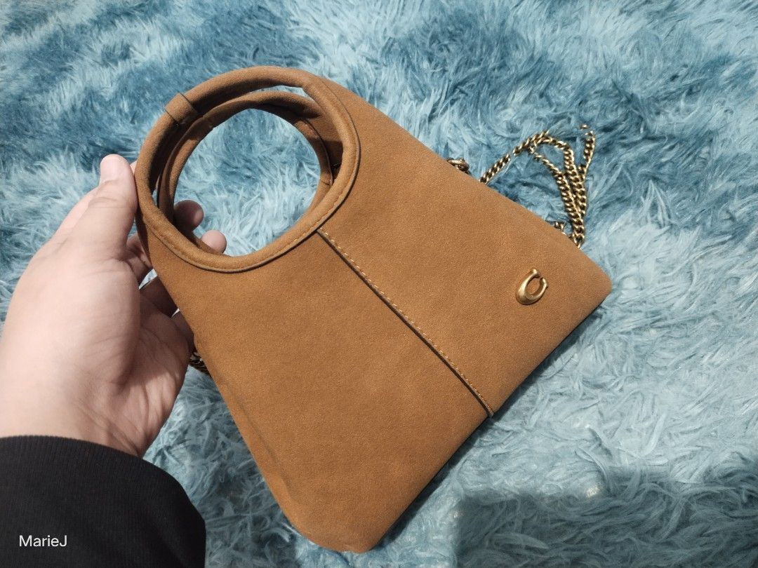 Coach Lana 19 (Category: Luxury Bags & Wallets) located in Manila. Submitted by inamarie.j104 (Listing ID 1429068698, Image 1). Description: Brown Suede Handbag with Chain Strap dustbag paperbag.