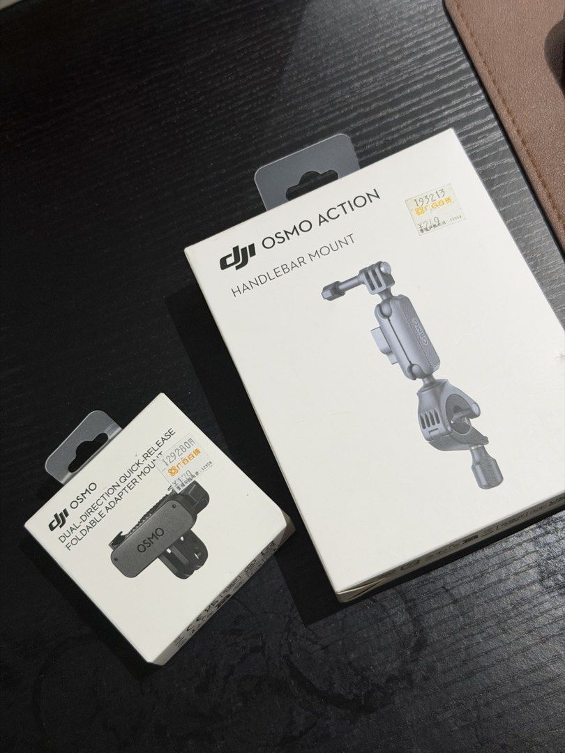 DJI Osmo Action Handlebar Mount & Adapter (Category: Video Cameras) located in Mabalacat. Submitted by tinedpsalvador_on_ig (Listing ID 1429008124, Image 1). Description: Includes a DJI Osmo Action Handlebar Mount and a Dual-Direction Quick-Release Foldable Adapter Mount. Both items are in their original packaging. The Handlebar Mount is designed for Osmo Action cameras, providing a secure way to attach your camera to handlebars. The adapter moun