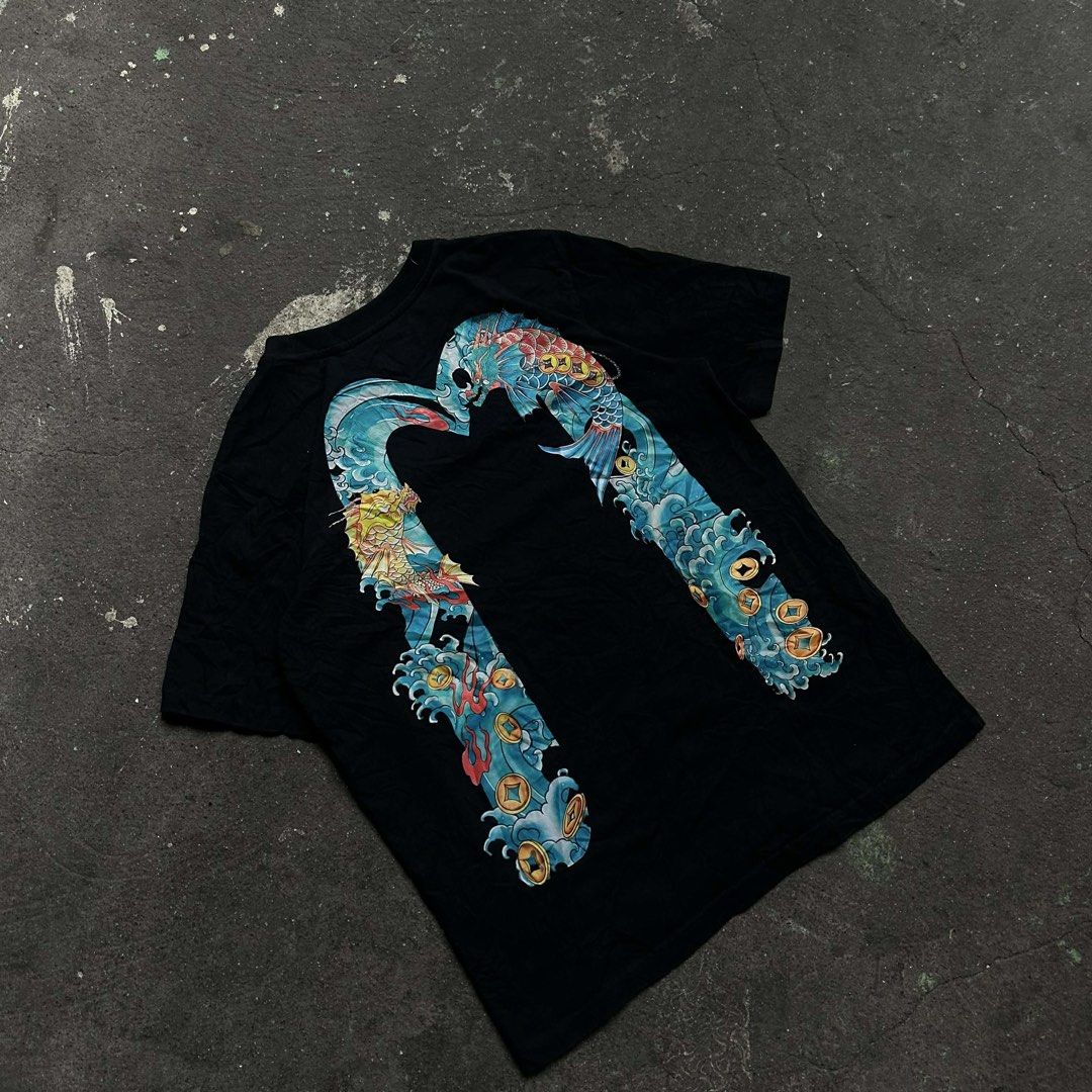 EVISU Koi Fish Graphic T-Shirt (Category: Tshirts & Polo Shirts ) located in Taguig. Submitted by thriftboy23 (Listing ID 1428996489, Image 1). Description: M to L Issue: May maliit na angat sa print 9.5/10 Color rate .