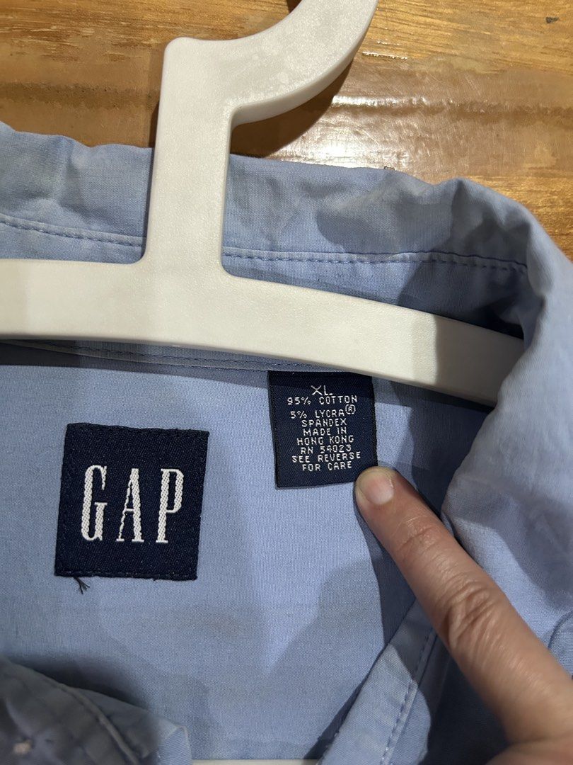 Authentic GAP Blue Long Sleeve Shirt XL (Category: Tshirts & Polo Shirts ) located in Manila. Submitted by Declutterland (Listing ID 1429087602, Image 3). Description: Blue long sleeve shirt from GAP. Features a button-down front and buttoned cuffs. The shirt has a classic collar and is made of a cotton and lycra blend. Size XL. Made in Hong Kong. Size: XL Chest: 44-46 inches Length: 31 inches Gcash/BPI/BDO J&T/Lalamove San Juan.