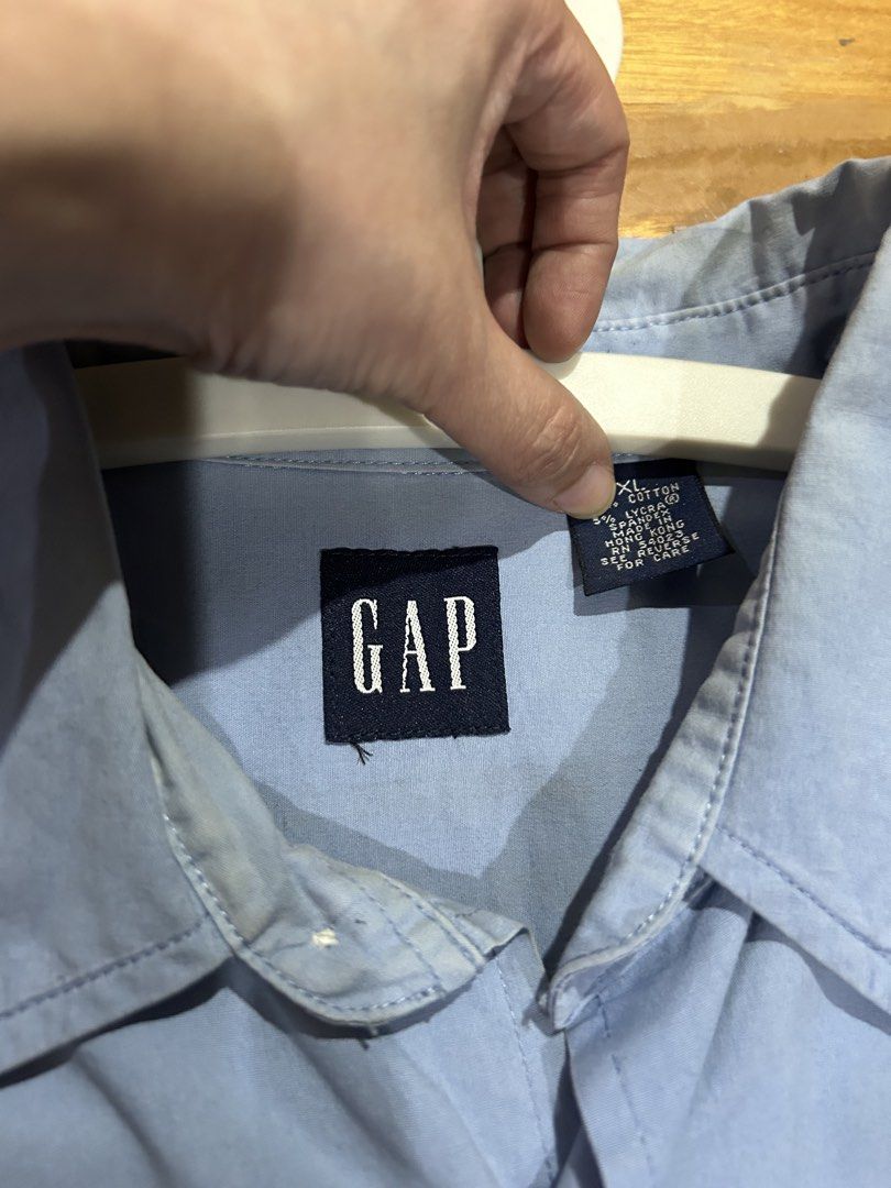 Authentic GAP Blue Long Sleeve Shirt XL (Category: Tshirts & Polo Shirts ) located in Manila. Submitted by Declutterland (Listing ID 1429087602, Image 2). Description: Blue long sleeve shirt from GAP. Features a button-down front and buttoned cuffs. The shirt has a classic collar and is made of a cotton and lycra blend. Size XL. Made in Hong Kong. Size: XL Chest: 44-46 inches Length: 31 inches Gcash/BPI/BDO J&T/Lalamove San Juan.