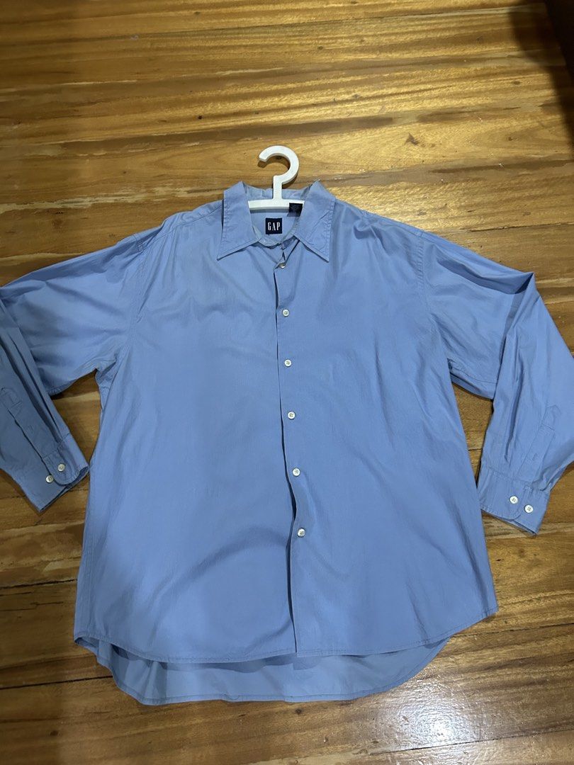Authentic GAP Blue Long Sleeve Shirt XL (Category: Tshirts & Polo Shirts ) located in Manila. Submitted by Declutterland (Listing ID 1429087602, Image 1). Description: Blue long sleeve shirt from GAP. Features a button-down front and buttoned cuffs. The shirt has a classic collar and is made of a cotton and lycra blend. Size XL. Made in Hong Kong. Size: XL Chest: 44-46 inches Length: 31 inches Gcash/BPI/BDO J&T/Lalamove San Juan.