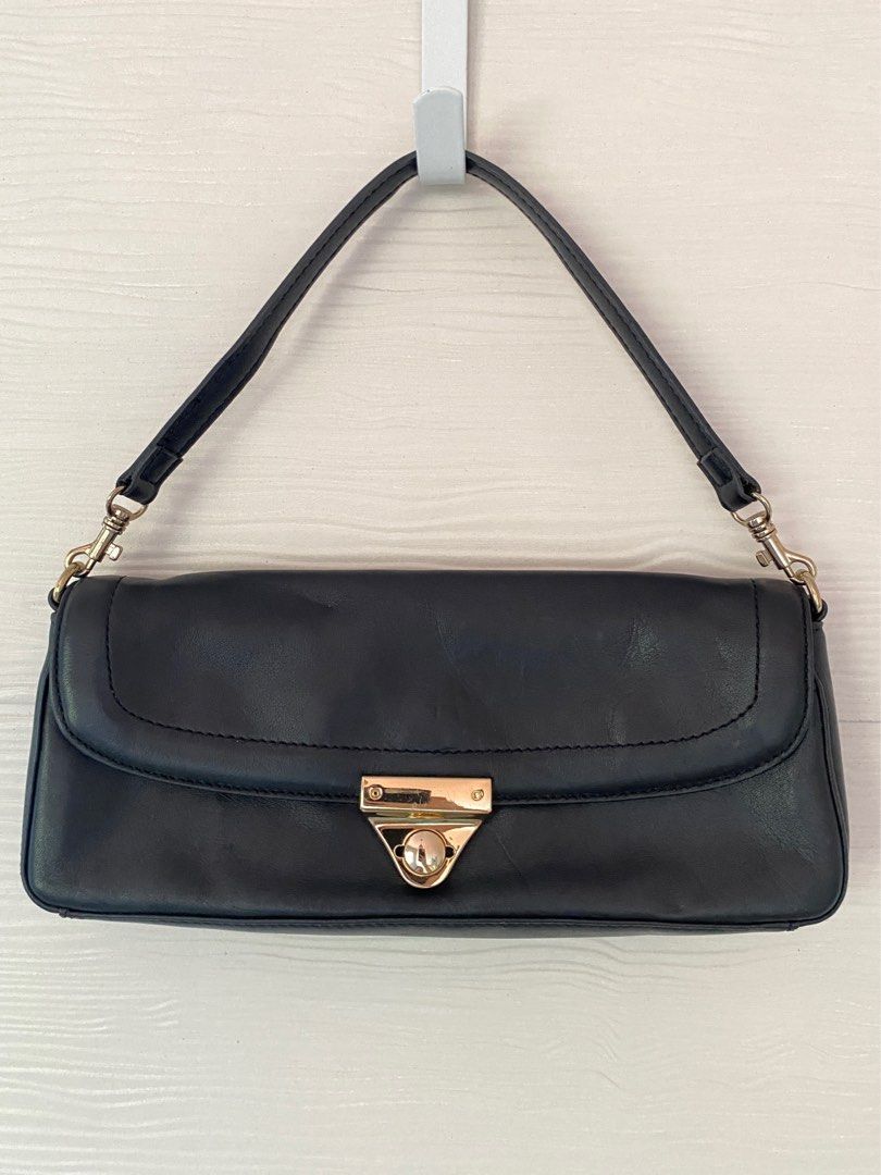 Giani Bernini Black Handbag (Category: Shoulder Bags) located in Davao. Submitted by editd (Listing ID 1429141572, Image 1). Description: Classic & vintage bag w/ gold hardware. Has a minor embossed mark on the outer front (see photo).