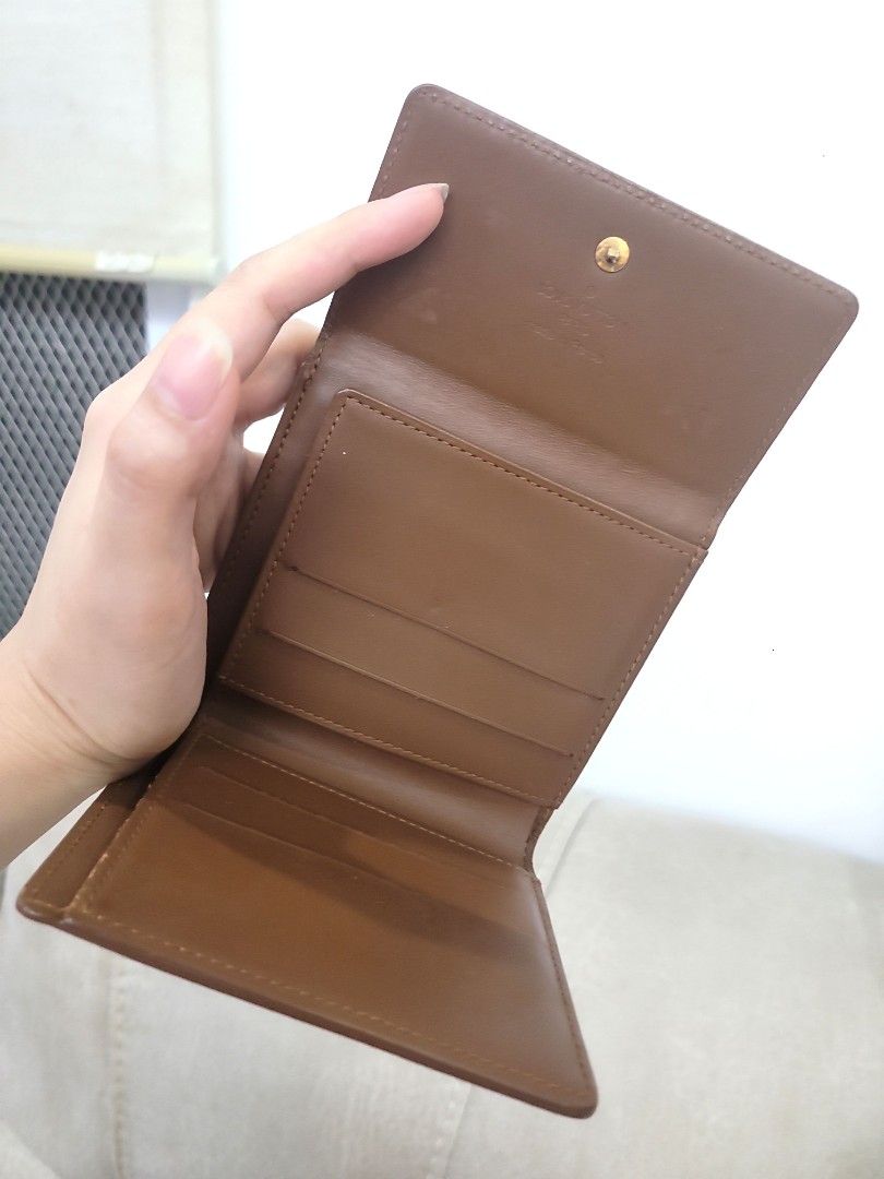 Guaranteed Auth Project Louis Vuitton Trifold Wallet Vernis (Category: Luxury Bags & Wallets) located in Antipolo. Submitted by dlolin (Listing ID 1429160265, Image 3). Description: Authentic Louis Vuitton trifold wallet. Features a brown exterior with the iconic LV monogram pattern. The interior has multiple card slots and a coin compartment. Made in France..