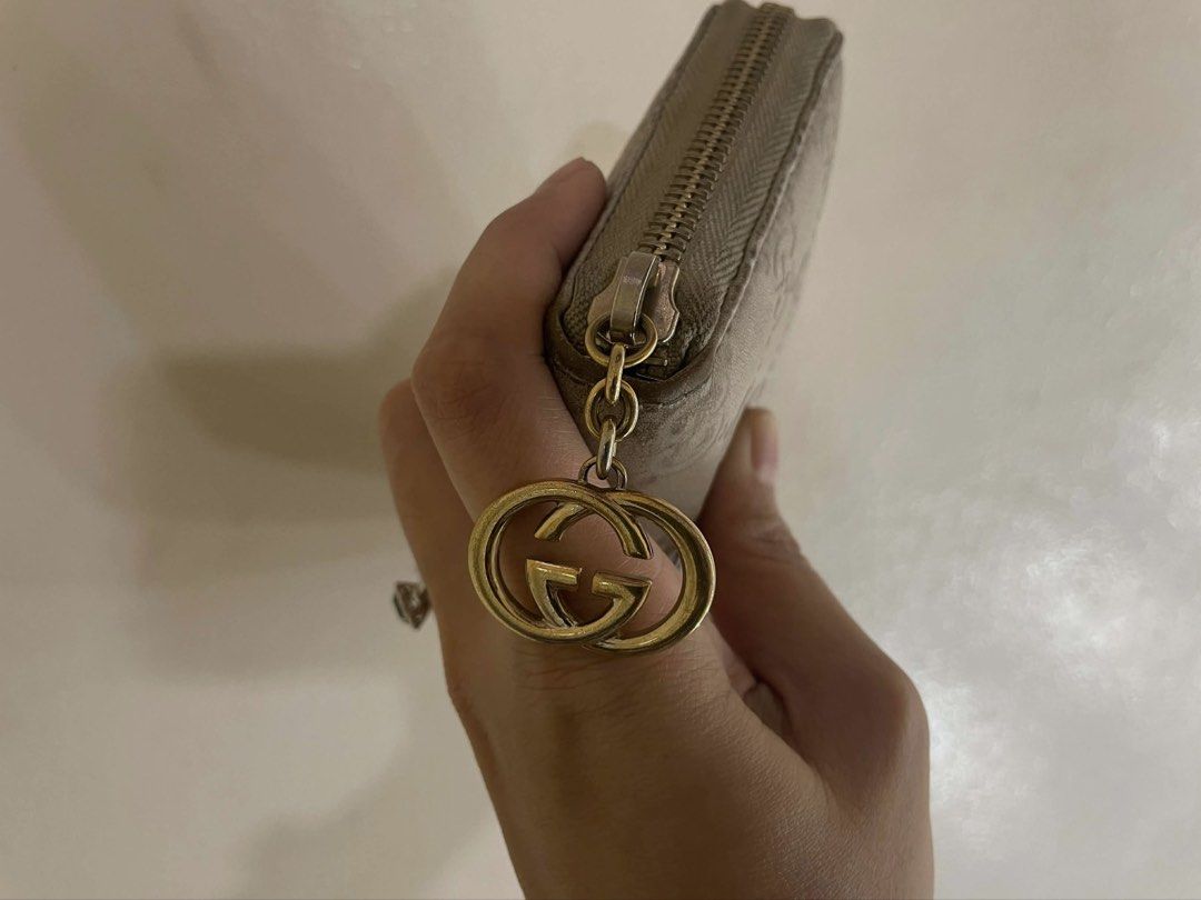Gucci GG Embossed Zip Around Wallet (Category: Luxury Bags & Wallets) located in Manila. Submitted by thevintagebow (Listing ID 1429077583, Image 2). Description: Timeless Elegance in the Palm of Your Hand. ✨ Up for grabs is this stunning Gucci Microguccissima Bree Wallet in a sophisticated metallic champagne leather. Featuring the iconic interlocking GG monogram and the signature gold-tone charm, this zip-around classic is the perfect blend of h