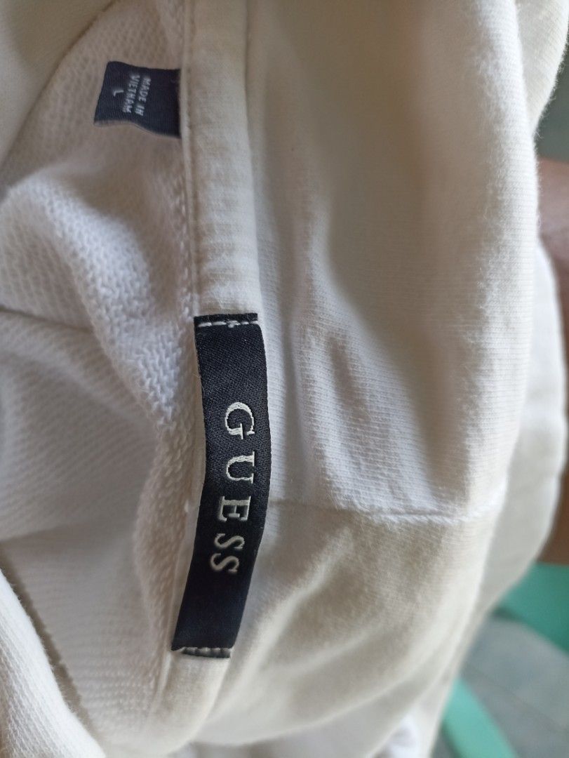 Guess Inc. White Hoodie - Large (Category: Hoodies) located in Cabadbaran. Submitted by _allgoodsthrift (Listing ID 1429038120, Image 3). Description: Guess Hoodie Large on tag but can fit to XL No crackprints/hairlines Issue - yellow stains in 5th pic but not noticeable Color Rate - 9.8 up to 10 Sobrang puti sa personal No backhit.