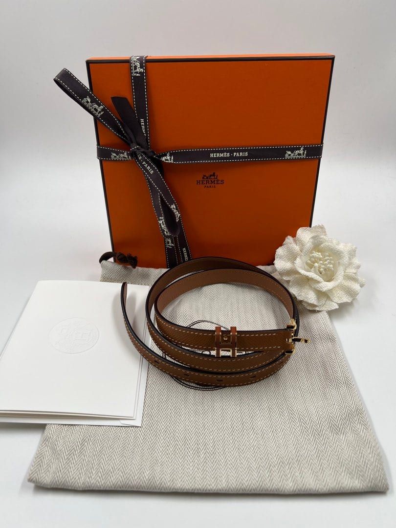⚜️Hermes Belt Pop H Belt (Category: Luxury Accessories) located in Makati City. Submitted by 90sangel (Listing ID 1429160354, Image 2). Description: •Item: Hermes Pop H Belt. Leather belt in Epsom calfskin with metal buckle. The iconic Pop H blends in, tone-on-tone, in the role of a loop passing on a thin and feminine belt. •Size: Width .59" 75-110cm •Condition: As New! *Features a tan leather strap with gold-tone hardware. Includes the original 