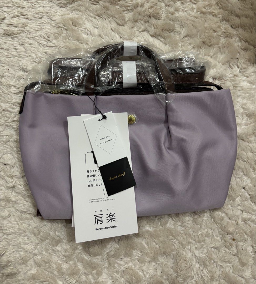 Legato Largo (Category: Luxury Bags & Wallets) located in Batangas. Submitted by aveena0413 (Listing ID 1429099816, Image 3). Description: Brand: Legato Largo Model: LH-L0005 Kataraku (Water-Repellent Nylon Mini Shoulder) Color: Lavender (Japan Design) Condition: Brand new, bought in Japan Features: • Water-repellent nylon — good for light rain and everyday use ￼ • Compact yet practical — fits essentials like phone, wallet, keys, and small access