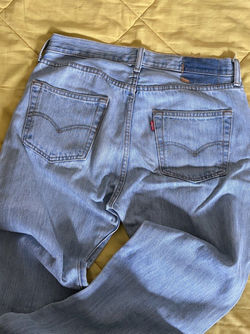 Levi's 501 Jeans (Category: Jeans) located in Manila. Submitted by rheinnnnnyday (Listing ID 1429138287, Image 3). Description: Classic Levi's 501 jeans. Features a button fly and the iconic Levi's red tab on the back pocket. The jeans have a light blue wash. The label inside indicates it is a pair of Levi's..