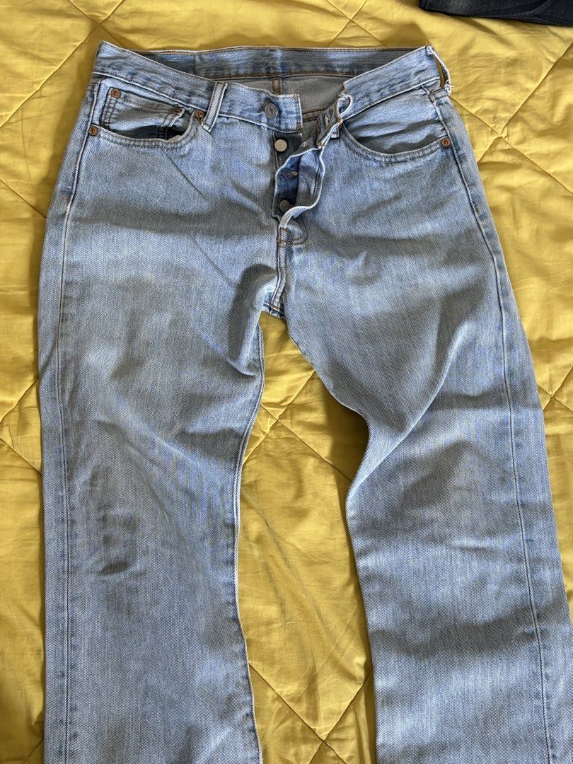 Levi's 501 Jeans (Category: Jeans) located in Manila. Submitted by rheinnnnnyday (Listing ID 1429138287, Image 2). Description: Classic Levi's 501 jeans. Features a button fly and the iconic Levi's red tab on the back pocket. The jeans have a light blue wash. The label inside indicates it is a pair of Levi's..