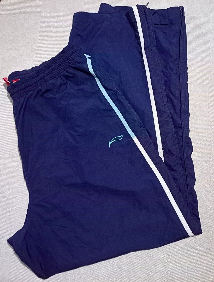 Li-Ning Track Pants in Navy Blue (Category: Joggers) located in Quezon City. Submitted by ri_yaaa (Listing ID 1429098460, Image 1). Description: ‼️PLEASE READ BEFORE BUYING ‼️ This is a pre-loved item. The color of the product may vary due to lighting. RFS: • Decluttering • Size XL on tag (W27-30 L40) • Navy Blue • Garterized w/ drawstring • Embroidered Li-Ning logo • Ankle zip (both working) • Condition 9/10 • Color rate 10/10 • Issue: No aglets