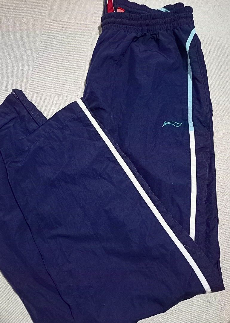 Li-Ning Track Pants in Navy Blue (Category: Joggers) located in Quezon City. Submitted by ri_yaaa (Listing ID 1429098460, Image 2). Description: ‼️PLEASE READ BEFORE BUYING ‼️ This is a pre-loved item. The color of the product may vary due to lighting. RFS: • Decluttering • Size XL on tag (W27-30 L40) • Navy Blue • Garterized w/ drawstring • Embroidered Li-Ning logo • Ankle zip (both working) • Condition 9/10 • Color rate 10/10 • Issue: No aglets