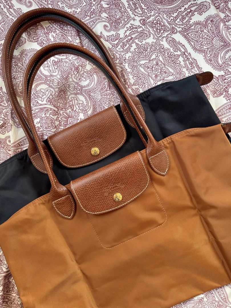 Longchamp Le Pliage Original Tote Bag Medium Long Handle (Category: Luxury Bags & Wallets) located in Paranaque City. Submitted by feonnaagito (Listing ID 1429078325, Image 1). Description: Longchamp Le Pliage Original Tote Bag Medium Long Handle (Color: Black) - Lightly used ❌ Cognac - SOLD ➡️ ₱8,000 each ‼️ Please manage your expectations as you are buying a pre-loved item—not brand new.