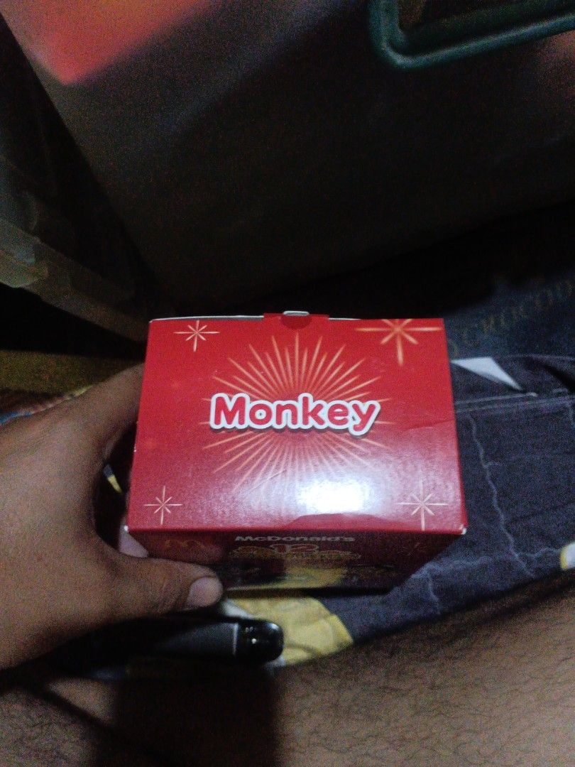McDonald's 12 Zodiacs Monkey Box (Category: Character Goods) located in Manila. Submitted by dailyhomiescollection (Listing ID 1429024843, Image 3). Description: THE BOX WAS A LITTLE DENT BUT IT WAS STILL NEW McDonald's 12 Zodiacs collectible box featuring the Monkey design. The box is red and has the McDonald's logo. The front of the box shows various cartoon characters. The side of the box has a monkey character. The box is likely from a promot